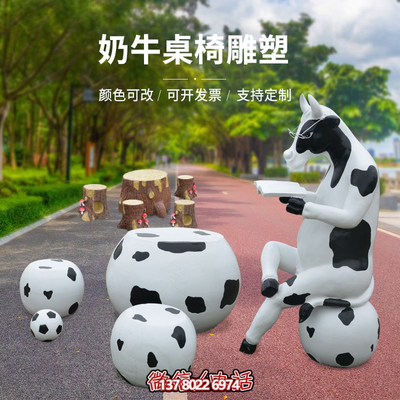 玻璃钢雕塑牛只着看书桌椅，林中户外休闲体验