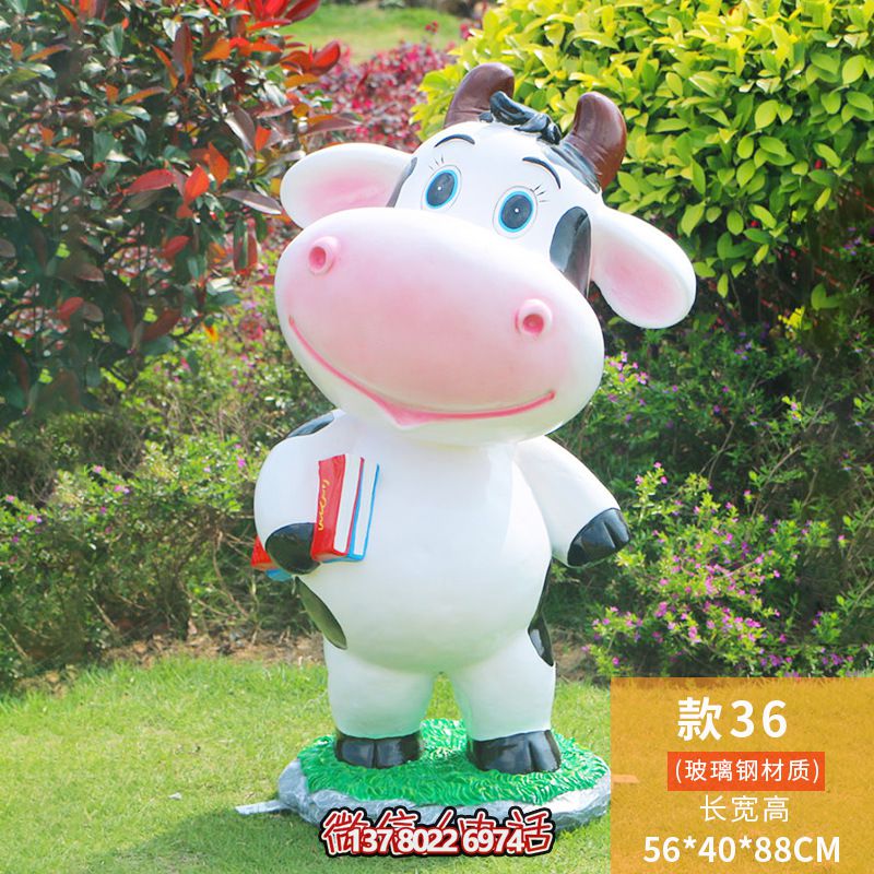 图书馆一只拿书的玻璃钢牛雕塑 图书馆一只拿书的玻璃钢牛雕塑
