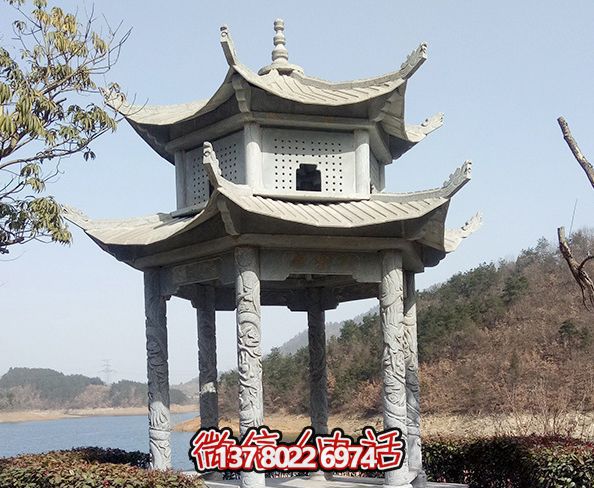 湖边景区摆放仿古建筑二层青石凉亭